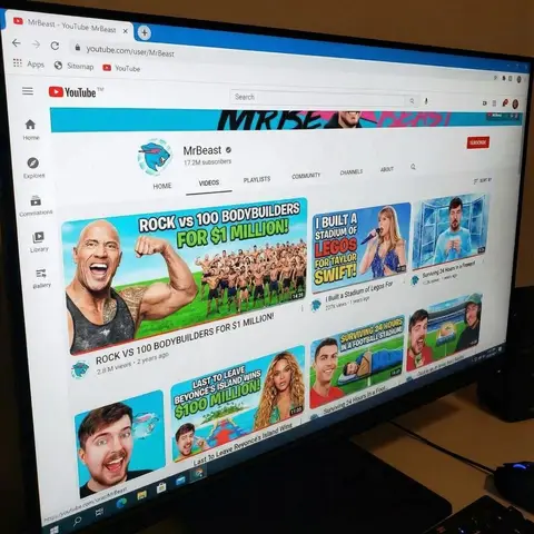 Макет страницы канала YouTube в оформлении MrBeast с заменёнными тематическими обложками видео.